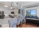 Modern kitchen with stainless appliances and quartz counters, complemented by cozy window seat dining area at 208 Ocean Blvd. N # 228, North Myrtle Beach, SC 29582