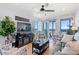 Bright living room with ocean view balcony, comfortable seating, and stylish decor and fixtures throughout at 208 Ocean Blvd. N # 228, North Myrtle Beach, SC 29582