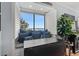 Cozy window seating area with beach view, open shutters, comfortable cushions, and beautiful decor at 208 Ocean Blvd. N # 228, North Myrtle Beach, SC 29582