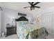 Comfortable main bedroom featuring a ceiling fan, access to the main bathroom, and nautical decor at 208 Ocean Blvd. N # 228, North Myrtle Beach, SC 29582