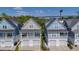 Beautiful aerial view of the home with second story porches and attached garages at 220 Gloucester Way, Little River, SC 29566