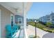 Inviting balcony with seating area offers a scenic view of the neighborhood and waterways for outdoor relaxation at 220 Gloucester Way, Little River, SC 29566