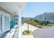 Enjoy the waterfront view from this lovely covered balcony with comfortable seating and charming decor and decor at 220 Gloucester Way, Little River, SC 29566