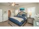Comfortable bedroom with a wooden-frame bed, blue bedding, and access to an ensuite bathroom for added convenience at 220 Gloucester Way, Little River, SC 29566