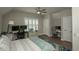 This bedroom has a ceiling fan, plantation shutters, and two desk areas, perfect for a home office or study at 220 Gloucester Way, Little River, SC 29566