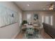 Cozy dining area with bright windows, blue accent pieces, and modern decor at 220 Gloucester Way, Little River, SC 29566