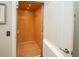 Convenient elevator with wood paneling and lighting ensures easy access to all levels of the home at 220 Gloucester Way, Little River, SC 29566