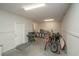 This spacious garage provides ample room for parking and storage, with room for bikes, a grill, and more at 220 Gloucester Way, Little River, SC 29566