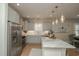 Bright kitchen with stainless steel appliances, marble countertops, and stylish decor at 220 Gloucester Way, Little River, SC 29566