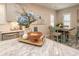Bright kitchen featuring stylish décor, white cabinets, and a cozy dining area at 220 Gloucester Way, Little River, SC 29566