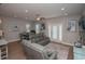 The well-decorated living room features modern couches and access to the dining area at 220 Gloucester Way, Little River, SC 29566
