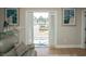 Cozy living room with starfish rug and picturesque view, framed by art, offers a tranquil and inviting atmosphere at 220 Gloucester Way, Little River, SC 29566