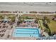 Birds eye view of beachside pool featuring lounge chairs, umbrellas, and palm trees at 2201 S Ocean Blvd. # 707, Myrtle Beach, SC 29577