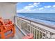 Serene balcony view of the beach featuring beach chairs and a picturesque ocean view at 2201 S Ocean Blvd. # 707, Myrtle Beach, SC 29577