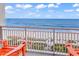Relaxing ocean view from the balcony with two chairs, overlooking a sandy beach and blue waters at 2201 S Ocean Blvd. # 707, Myrtle Beach, SC 29577