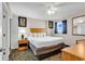 Cozy bedroom with a comfortable bed, ceiling fan, and ample natural light at 2201 S Ocean Blvd. # 707, Myrtle Beach, SC 29577