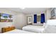 Bedroom featuring two beds, a dresser, and a TV at 2201 S Ocean Blvd. # 707, Myrtle Beach, SC 29577