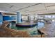 Bright indoor lazy river with tiled brick surround and staircase with ocean view at 2201 S Ocean Blvd. # 707, Myrtle Beach, SC 29577