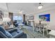 Inviting living area featuring comfortable seating, a dining table, and a sliding glass door to the balcony with an ocean view at 2201 S Ocean Blvd. # 707, Myrtle Beach, SC 29577