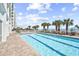 Outdoor pool with marked lanes and palm trees next to beach and high rise at 2201 S Ocean Blvd. # 707, Myrtle Beach, SC 29577
