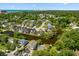 Community aerial view with a scenic waterfront canal, lush trees, and beautiful coastal views at 2213 Gazebo Ct., North Myrtle Beach, SC 29582