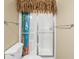 Small bathroom with a shower and a playful curtain is accented by tiki trim at 2213 Gazebo Ct., North Myrtle Beach, SC 29582