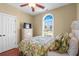 Cozy bedroom featuring a comfortable bed, dresser, and a window offering scenic views of the neighborhood at 2213 Gazebo Ct., North Myrtle Beach, SC 29582