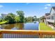 Scenic view of canal and homes along the water, as seen from wooden deck area at 2213 Gazebo Ct., North Myrtle Beach, SC 29582