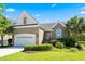 Charming brick home with well-manicured lawn and attached two-car garage under a bright blue sky at 2213 Gazebo Ct., North Myrtle Beach, SC 29582