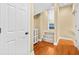 Spacious hallway leads to the bedrooms with a white cabinet for extra storage at 2213 Gazebo Ct., North Myrtle Beach, SC 29582