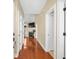 Inviting hallway with hardwood floors and multiple doorways leading to various rooms in the home at 2213 Gazebo Ct., North Myrtle Beach, SC 29582