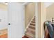 Entryway and staircase combination with wood flooring and a neutral color palette at 2213 Gazebo Ct., North Myrtle Beach, SC 29582
