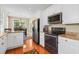 Bright kitchen featuring stainless steel appliances, white cabinets, and granite countertops at 2213 Gazebo Ct., North Myrtle Beach, SC 29582