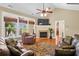 Bright and airy living room with a fireplace, comfortable seating, and views of the outdoor area at 2213 Gazebo Ct., North Myrtle Beach, SC 29582