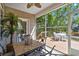 Relaxing screened porch with ceiling fan and view of outdoor seating area on wooden deck at 2213 Gazebo Ct., North Myrtle Beach, SC 29582