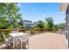 Outdoor wooden deck area overlooking canal has beautiful view with white table and chairs at 2213 Gazebo Ct., North Myrtle Beach, SC 29582