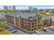 Aerial view of the multi-story condo building near lush landscaping and the ocean at 223 Maison Dr. # F-12, Myrtle Beach, SC 29572