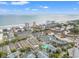 Coastal community aerial view showing ocean front condominiums and marsh views with neighborhood homes at 223 Maison Dr. # F-12, Myrtle Beach, SC 29572