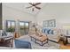 Bright living room with comfortable seating, decor, and a sliding glass door leading to a balcony at 223 Maison Dr. # F-12, Myrtle Beach, SC 29572