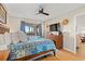 Spacious main bedroom featuring lots of natural light, a ceiling fan, and a TV at 223 Maison Dr. # F-12, Myrtle Beach, SC 29572
