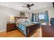 Comfortable main bedroom with wood furniture, ceiling fan, and private access to balcony at 223 Maison Dr. # F-12, Myrtle Beach, SC 29572