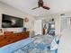 Bright main bedroom featuring a large dresser and a beautiful blue comforter on the bed at 223 Maison Dr. # F-12, Myrtle Beach, SC 29572