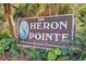 Heron Pointe: A private resort community with lush landscaping surrounding the neighborhood sign at 223 Maison Dr. # F-12, Myrtle Beach, SC 29572