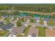 Aerial view of a neighborhood featuring homes, ponds, and green space at 227 Hickory Springs Ct., Conway, SC 29527