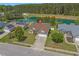 Aerial view of a home with a pond, mature trees, and well maintained landscaping at 227 Hickory Springs Ct., Conway, SC 29527