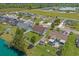 Aerial view of a neighborhood featuring homes, yards, a pond, and surrounding greenery at 227 Hickory Springs Ct., Conway, SC 29527
