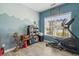 Bedroom featuring laminate wood floors, large window, and exercise equipment at 227 Hickory Springs Ct., Conway, SC 29527