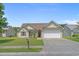 Charming single-story home featuring a well-manicured lawn and a two-car garage at 227 Hickory Springs Ct., Conway, SC 29527