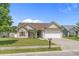 Traditional-style house with a 2 car garage, green lawn, and mature tree at 227 Hickory Springs Ct., Conway, SC 29527