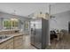 Open kitchen with stainless steel refrigerator and eat-in breakfast nook with natural lighting at 227 Hickory Springs Ct., Conway, SC 29527